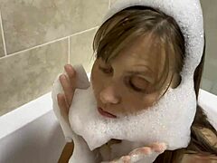Mature brunette sings in the bath