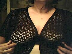 Mature woman with saggy breasts pleasures herself on camera