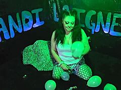 Kandi Laigne, a charming mature woman, indulges in her unusual fascination for balloon popping in a safe and consensual manner.