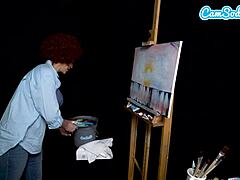 Косплейът на Райън Кийли, докато Боб Рос я възбужда по време на урок по рисуване на уеб камера